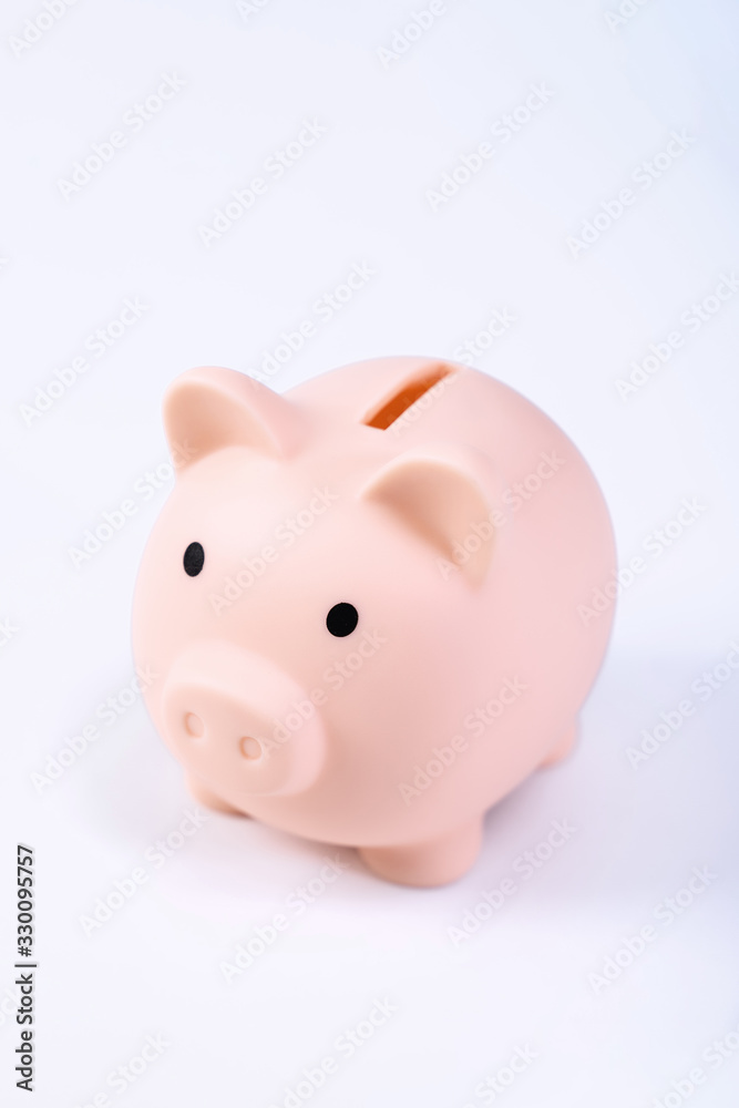 Financial concpet - Piggy bank, beautiful red white wooden house model on white background, saving money to buy insurance, close up, copy space.