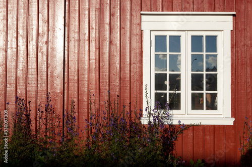 Lofoten Islands / Norway - August 30, 2017: House with traditional wood window, Lofoten Islands, Nordland, Norway, Scandinavia, Europe photo