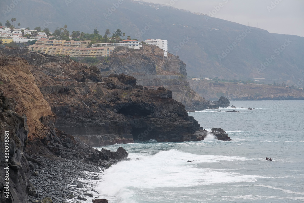 Buildings on coast of Atlantic ocean in Puerto de la Cruz, Tenerife island