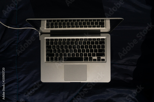 this image is illustration of electronic device (macbook)image getting charged. 