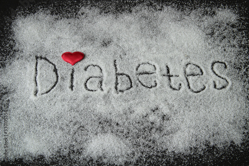 the word diabetes, sugar written on a black background with a red heart