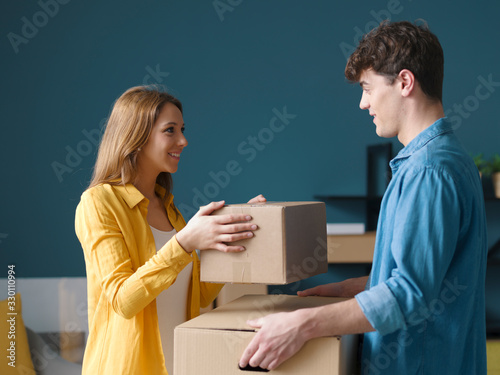 Happy couple moving in their new house