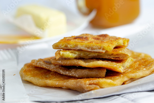Pan fried whole wheat paratha, stuffed with sliced banana and cheese, crispy on the outside and soft on the inside
