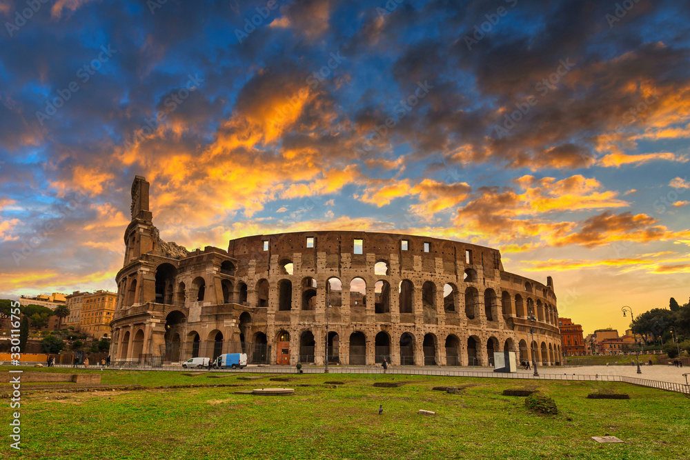 The Colosseum in Rome illuminated at sunrise, Italy