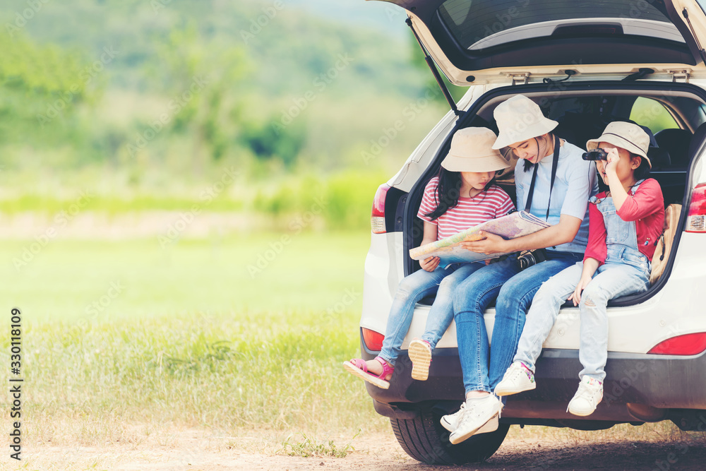 Group family children travel on car for adventure nature in vacations.  Asia people tourism checking map for explore natural destination and leisure trips travel for education.  Travel Concept