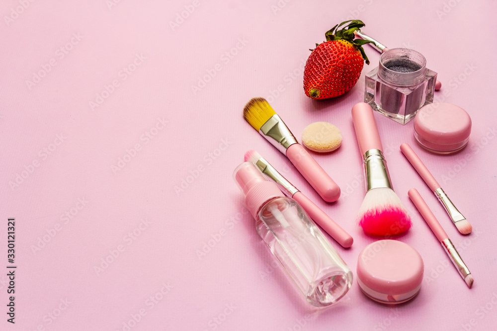 Makeup cosmetic set on pink background Makeup cosmetic set on pink background
