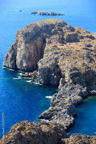 Lindos, Rhodes / Greece - June 23, 2014: The cliffs view near Lindos, Rhodes, Dodecanese Islands, Greece.