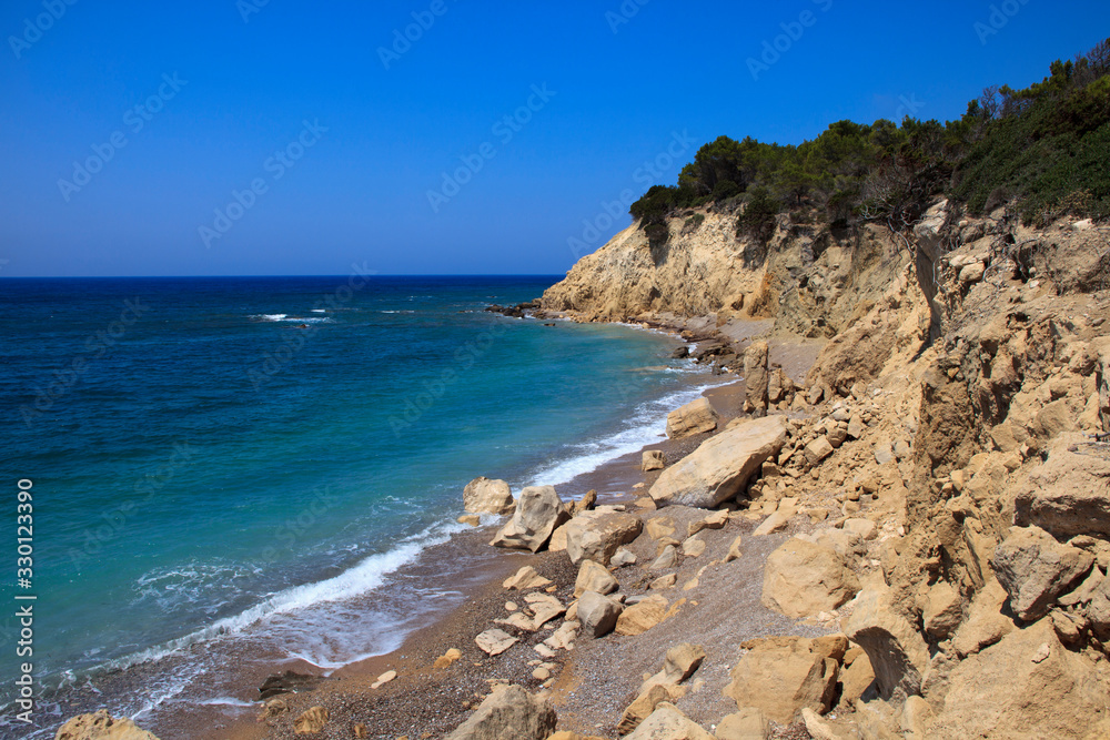 Obraz premium Kamiros, Rhodes / Greece - June 23, 2014: A beach near Kamiros, Rhodes, Dodecanese Islands, Greece.