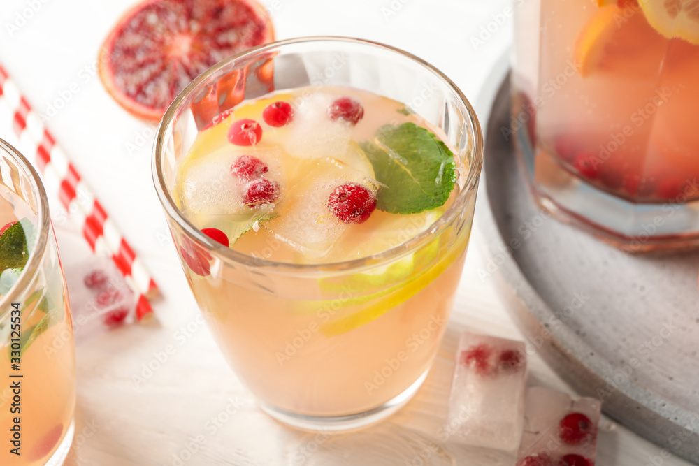 Lemonade with cranberry and lemon on wooden background. Fresh drink Lemonade with cranberry and lemon on wooden background. Fresh drink