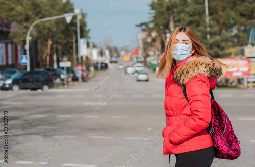 Virus concept. Girl in mask at city, risk for health, pneumonia, quarantine and epidemic