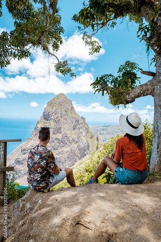 couple on vacation at the tropical Island of St Lucia, men and woman watching sunset Saint Lucia Caribbean photo