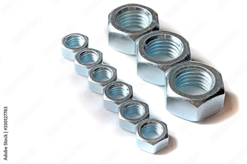Big and small screw-nut. Concept. White background. Big and small screw-nut. Concept. White background.