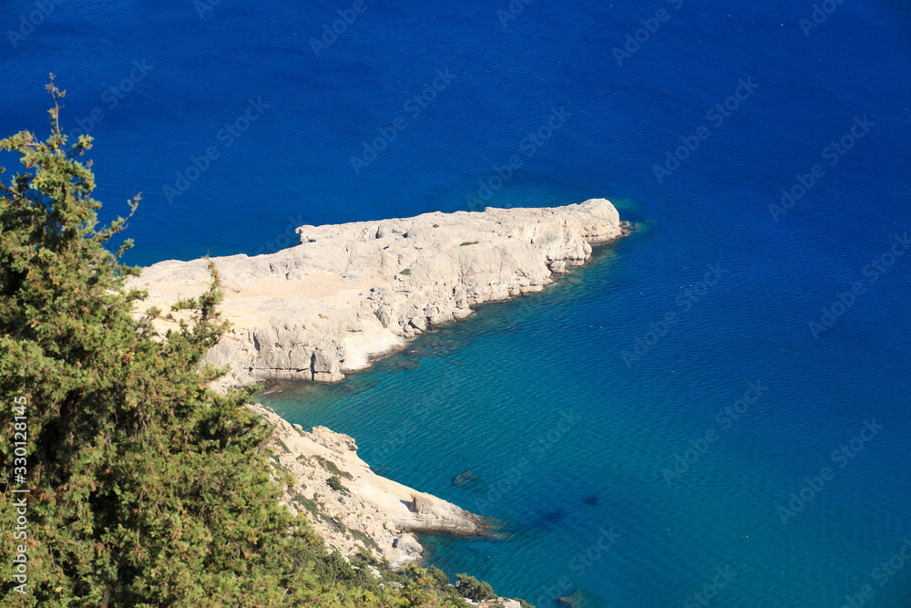 Tsampika, Rhodes / Greece - June 23, 2014: Cliff near the beach of Tsampika on the east coast, Rhodes, Dodecanese Islands, Greece.
