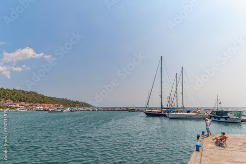 Nea Skioni  Greece - September 06  2019  The Harbour entrance at Nea Skioni Kassandra  Chalkidiki  Central Macedonia  Greece. Greek marina with parked boats and yachts