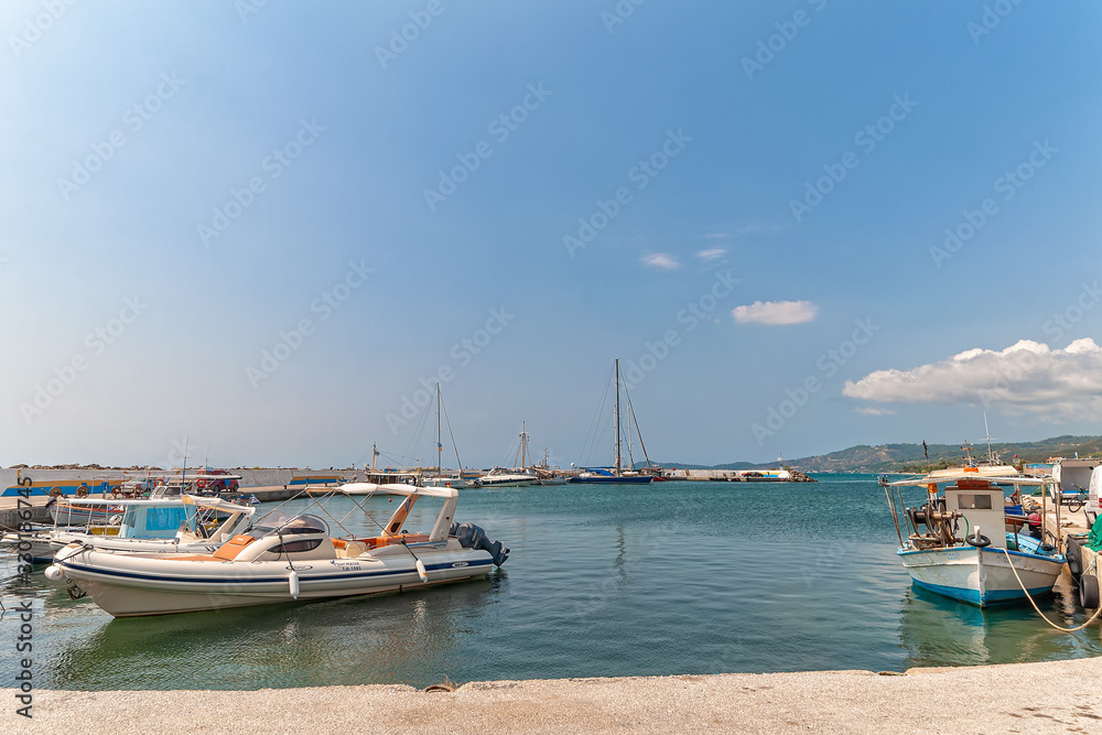 Nea Skioni, Greece - September 06, 2019: The Harbour entrance at Nea Skioni Kassandra, Chalkidiki, Central Macedonia, Greece. Greek marina with parked boats and yachts