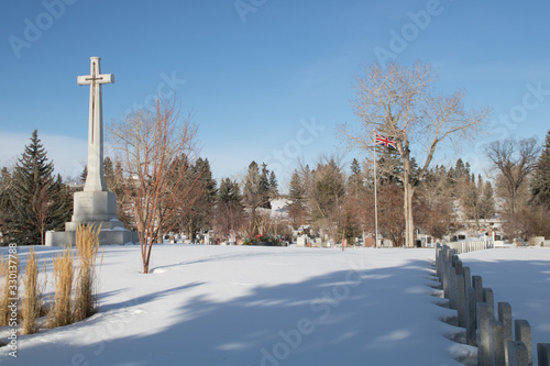 Sun rises over the grave markers of the fallen. Burnsland Cemetry, Calgary, Alberta, Canada