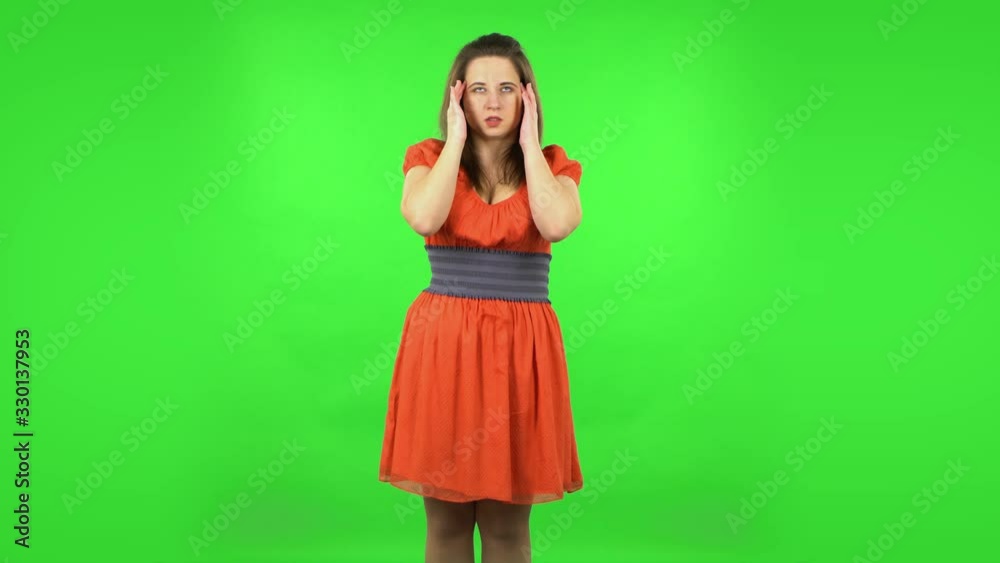 Cute girl suffering from headache from fatigue . Green screen Cute girl suffering from headache from fatigue . Green screen