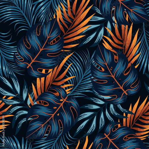 Botanical seamless tropical pattern with bright yellow and blue plants and leaves on a black background. Jungle leaf seamless vector floral pattern background.  Beautiful exotic plants.  photo