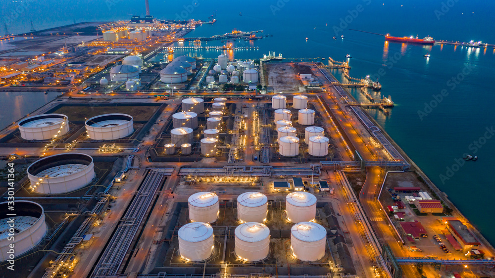 Aerial view oil and gas terminal storage tank farm,Tank farm storage chemical petroleum petrochemical refinery product, Business commercial trade fuel and energy transport by tanker vessel.