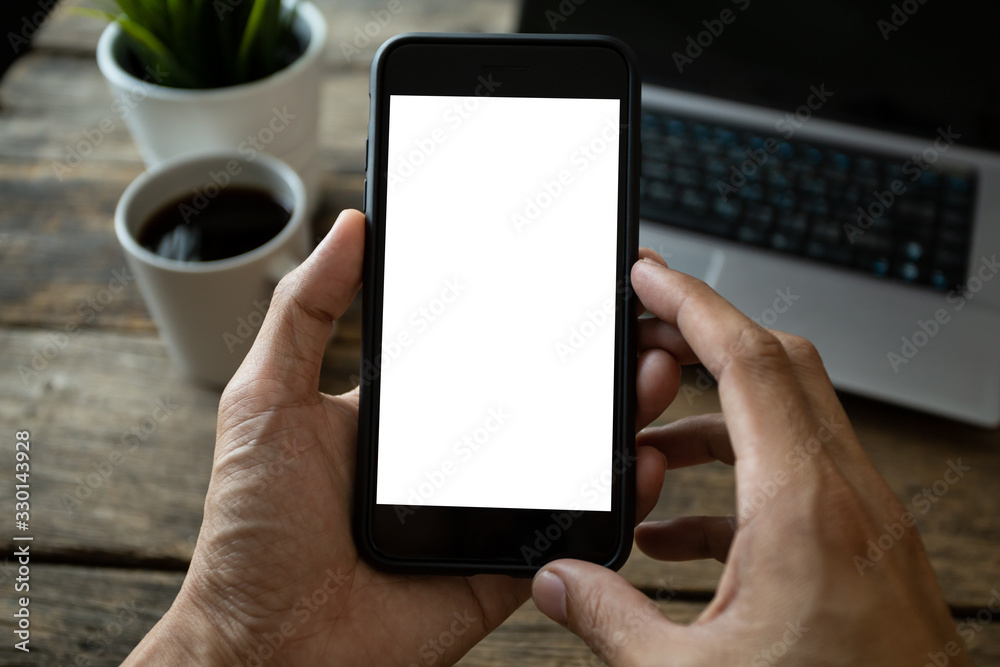 man hand using smartphone In the coffee shop,Screen blank with clipping path