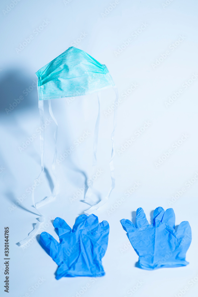 surgical mask and gloves on a white background for protection from coronavirus