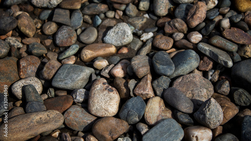 Beautiful pebble on the beach. Grunge pebble background.