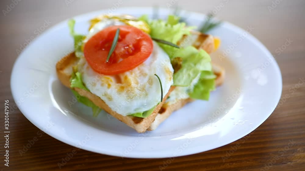 fried toasts with egg, salad, tomato in a plate fried toasts with egg, salad, tomato in a plate