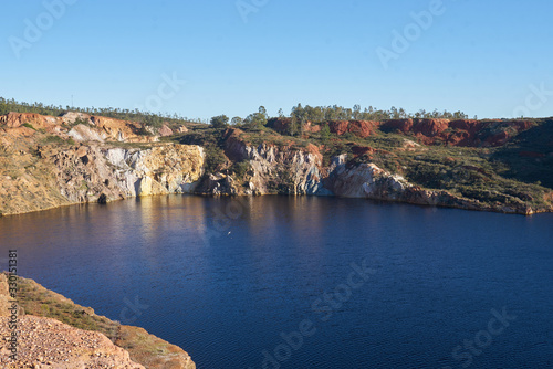 Contaminated pond lake of an old abandoned mine red landscape in Mina de Sao Domingos, Portugal