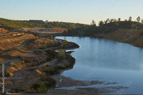 Contaminated pond lake of an old abandoned mine red landscape in Mina de Sao Domingos  Portugal