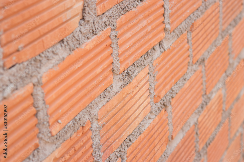 Close up view of a brick wall on a construction site, Construction concept.