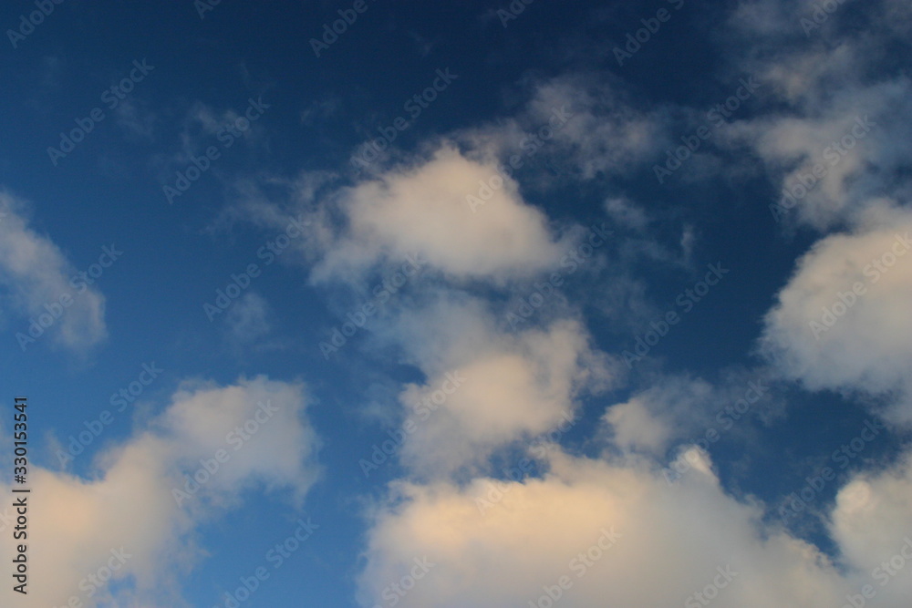 Blue sky with wispy clouds 