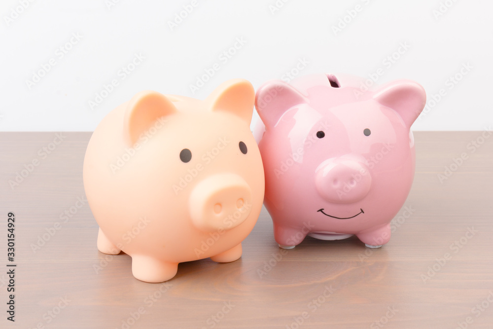 Piggy bank  on wooden background, space for text. Finance, saving money