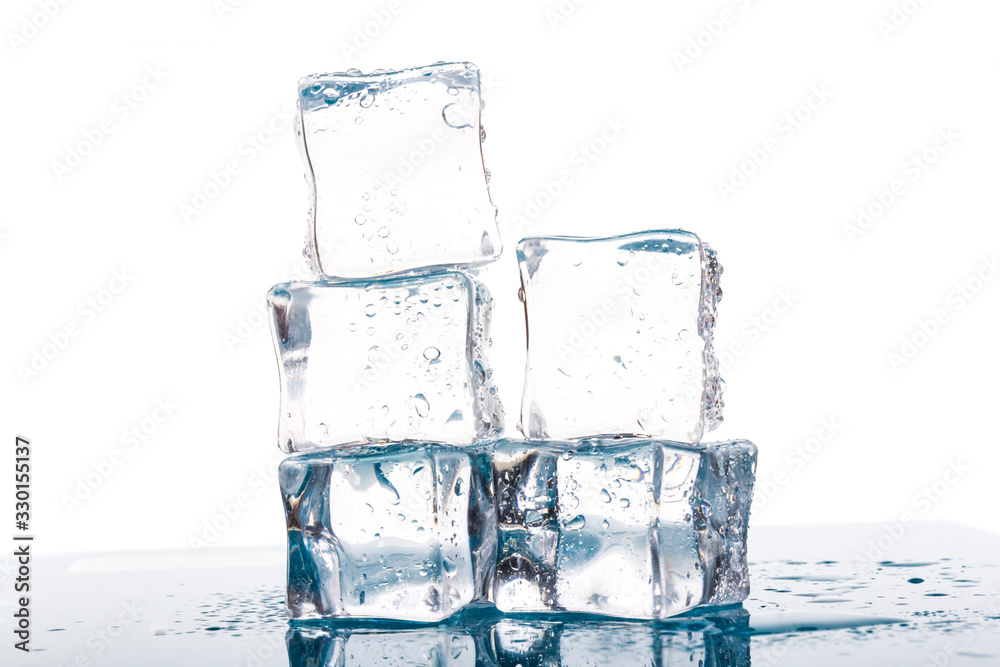 ice cubes and water drops close up on blue and white background