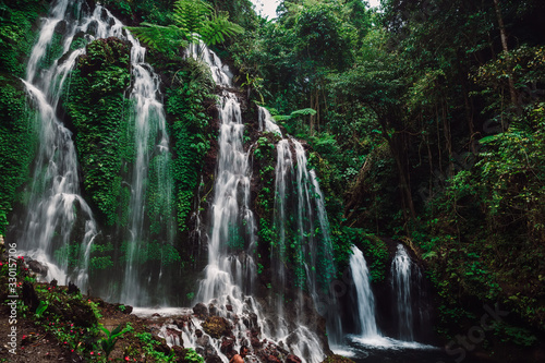 Fototapeta Naklejka Na Ścianę i Meble -  Amazing cascade waterfall in a tropical jungle at Bali