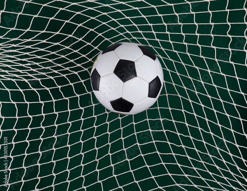 goal net, soccer ball in goal, green background