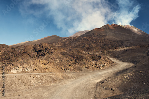 Winding road going up to Etna volcano, Sicily, Italy