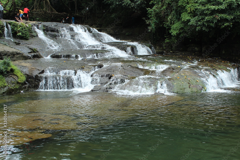 Obraz premium Beauty of a slanting waterfalls in the forest