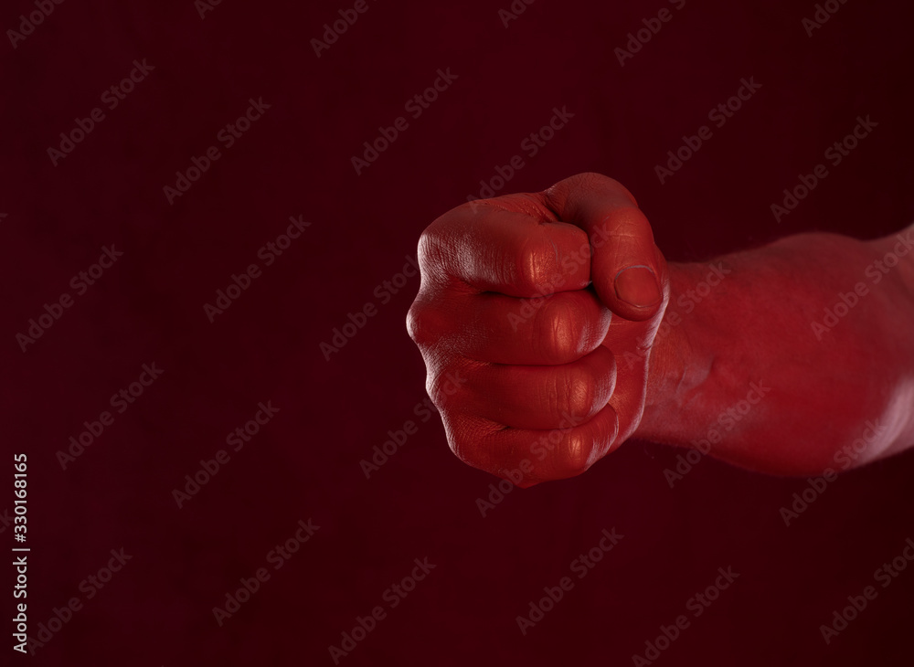 red bloody fist on a red background