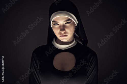 Canvastavla gloomy portrait of a young nun closeup