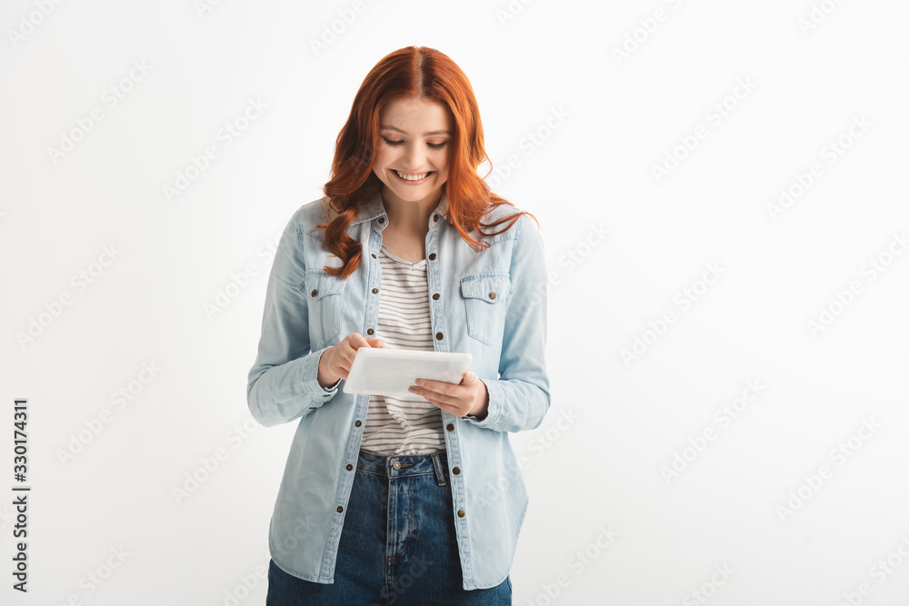 beautiful smiling teenager using digital tablet, isolated on white beautiful smiling teenager using digital tablet, isolated on white