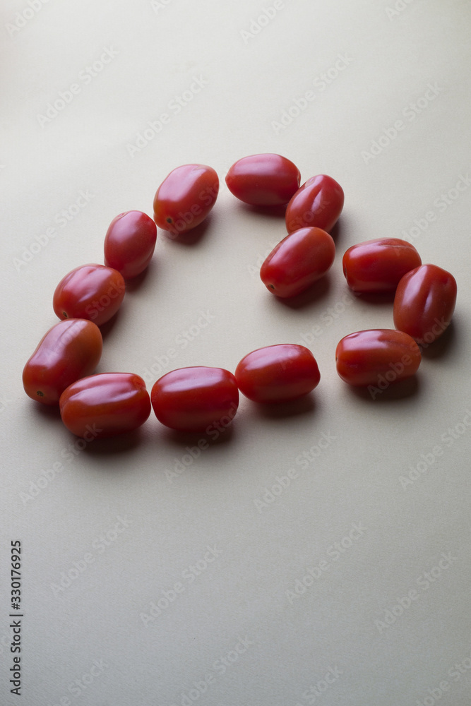 red bright tomatoes on a monotone background red bright tomatoes on a monotone background