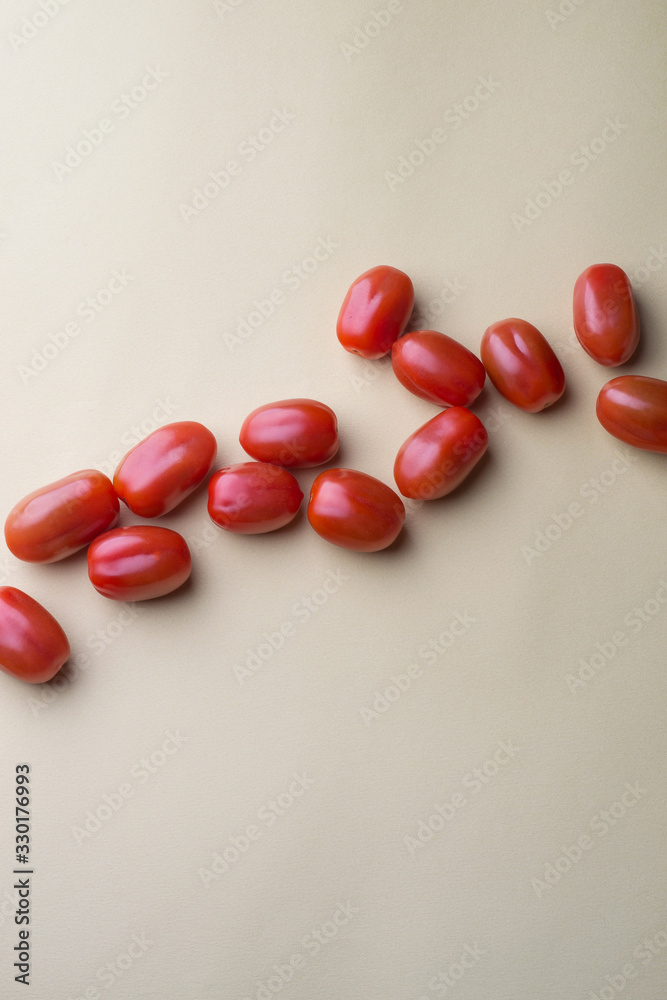 red bright tomatoes on a monotone background