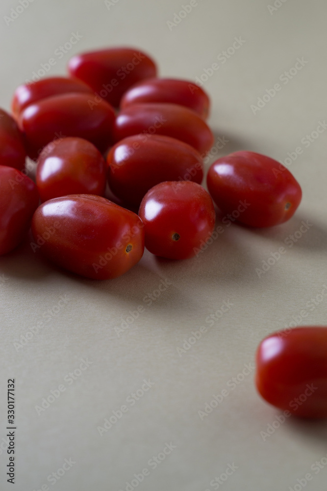 red bright tomatoes on a monotone background red bright tomatoes on a monotone background
