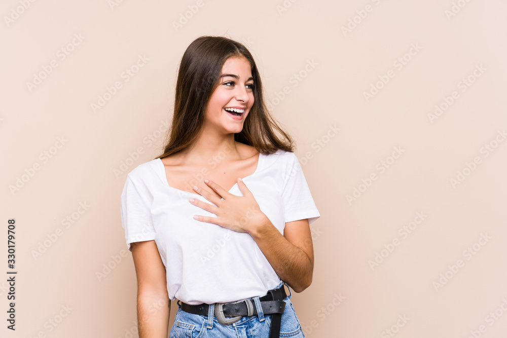 Young caucasian woman posing isolated laughs out loudly keeping hand on chest. Young caucasian woman posing isolated laughs out loudly keeping hand on chest.