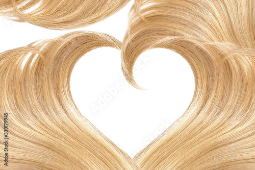 Blonde hair in shape of heart, isolated on white background