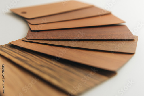 a set of color sample cards on a light background. color plates with a wooden texture for selecting the material . the top view of the color selection