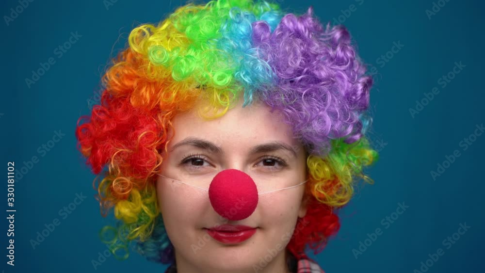 portrait of a clown on a blue background portrait of a clown on a blue background
