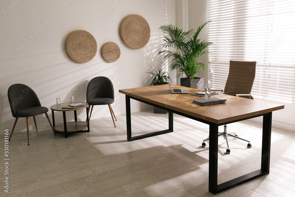 Director's office with large wooden table. Interior design