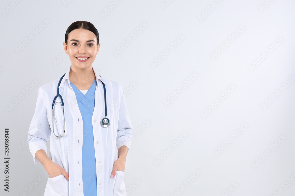 Portrait of young doctor with stethoscope on white background Portrait of young doctor with stethoscope on white background
