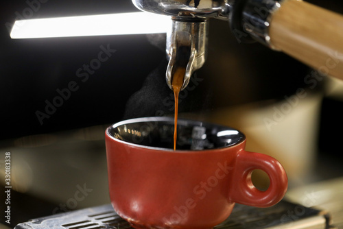 detail of espresso machine making coffee